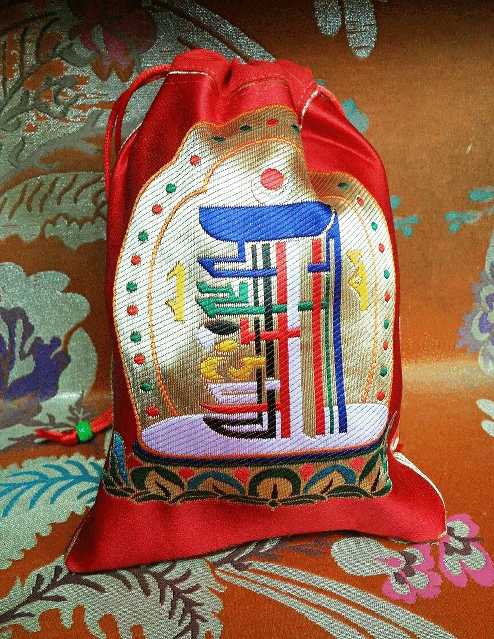 Pochettes/sacs à bijoux en brocart de soie tibétain de haute qualité avec motif Kalachakra rouge