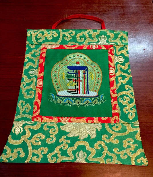 This is high quality silk brocade kalachakra wall hanging, bordered with beautiful lotus design silk brocade . This thangka is perfect for your office , dharma centers , shrine room or puja room.