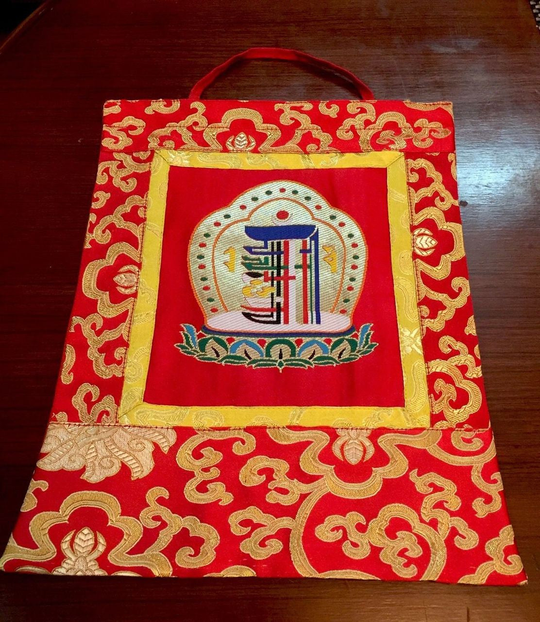 This is high quality silk brocade kalachakra wall hanging, bordered with beautiful lotus design silk brocade . This thangka is perfect for your office , dharma centers , shrine room or puja room.