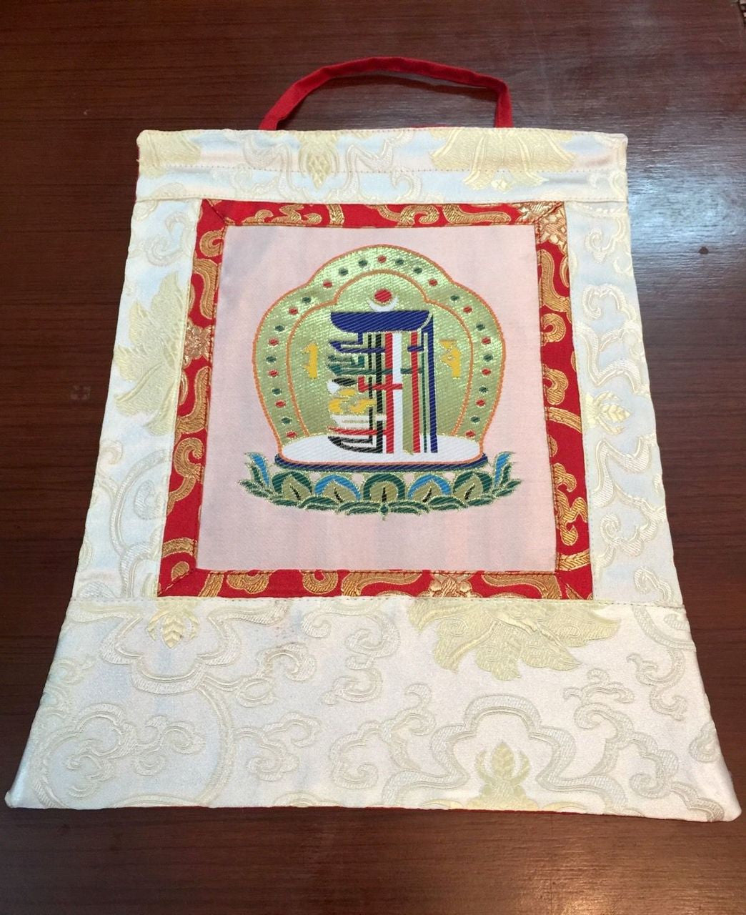 This is high quality silk brocade kalachakra wall hanging, bordered with beautiful lotus design silk brocade . This thangka is perfect for your office , dharma centers , shrine room or puja room.